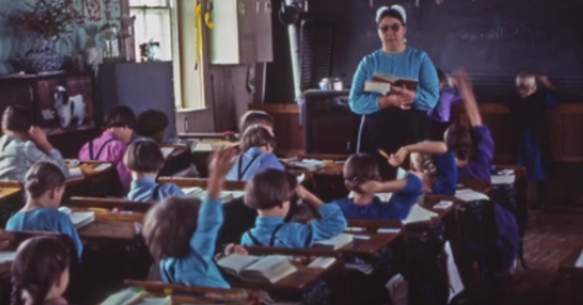 a group of Amish students listening to Amish teacher