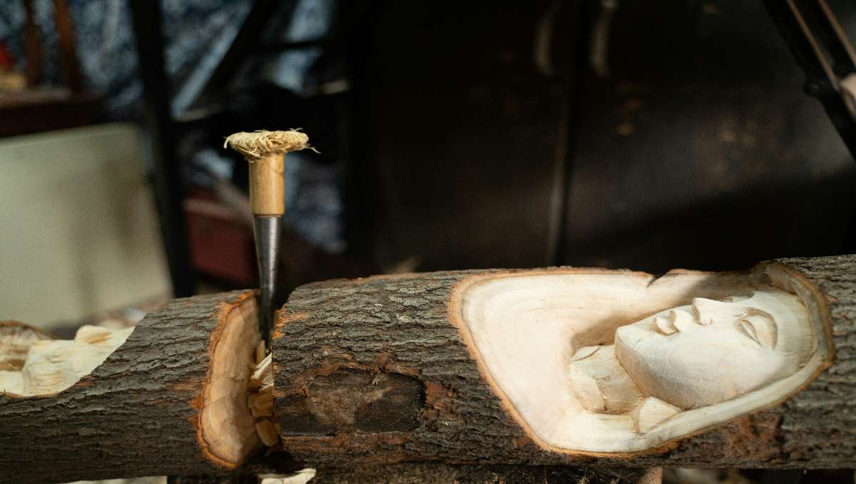 A carved wood with a woman image