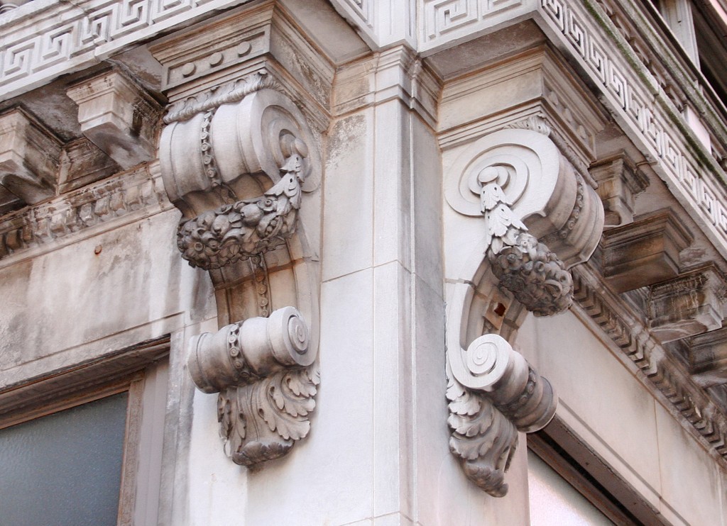 Stone corbels on the corner of a neoclassical building in Indianapolis