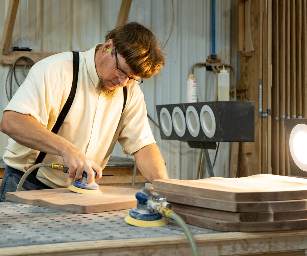 An Amish builder doing woodworking.