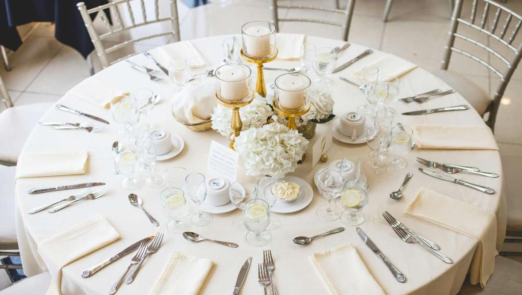 A white round table with 8 seats