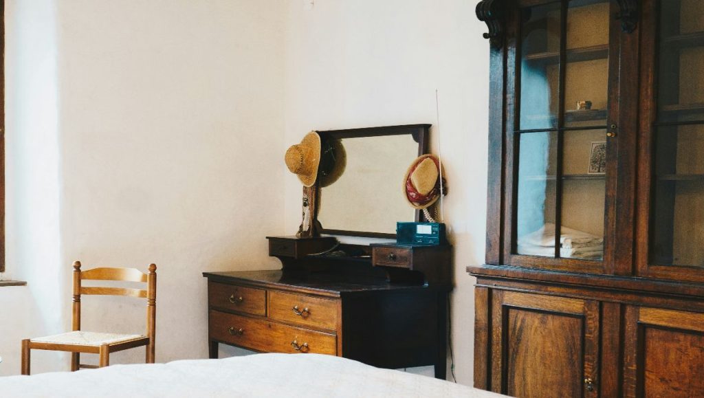 Antique dresser with mirror in the bedroom